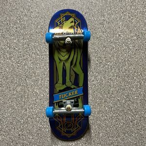 Tech Deck Mini Skateboard featuring Nick‎ Tucker and a unique wolf design.